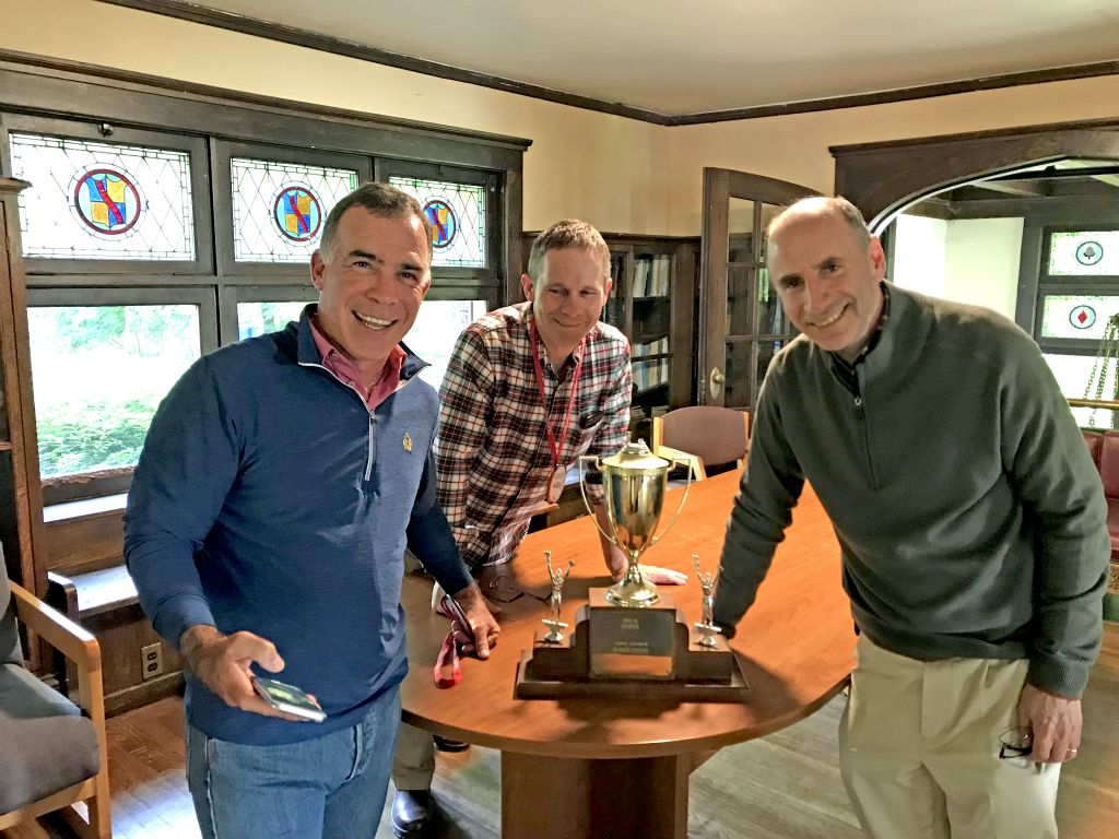 The old intramurals trophies are still in the library! Dave Terris '84, Chris Wilsey '84, and Brian Bornstein '84.