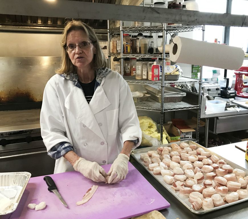 Our awesome cook Cindy getting the bacon-wrapped scallops ready.